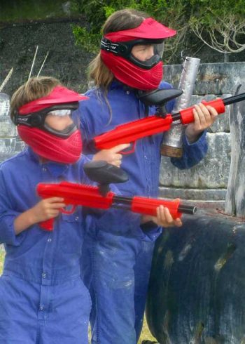Gotcha-Asylum-Paintball-Two-Brothers-Tweens-Playing-Together-Red-Mask-Red-Gun