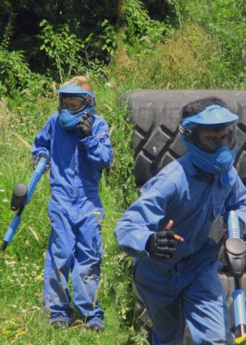 Gotcha-Asylum-Paintball-Two-Friends-Playing-Together-Blue-Guns
